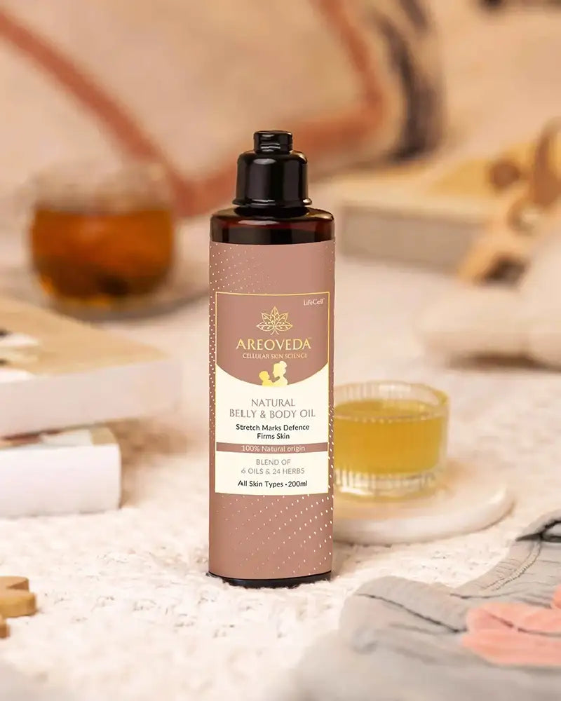 Areoveda belly and body oil bottle on a blurred background with a person and tea.