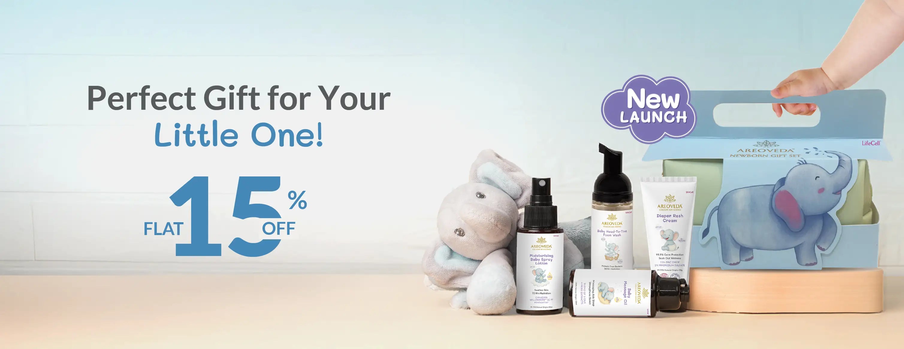 Baby products and a box with a baby elephant design on a light blue background, promoting a 15% discount.