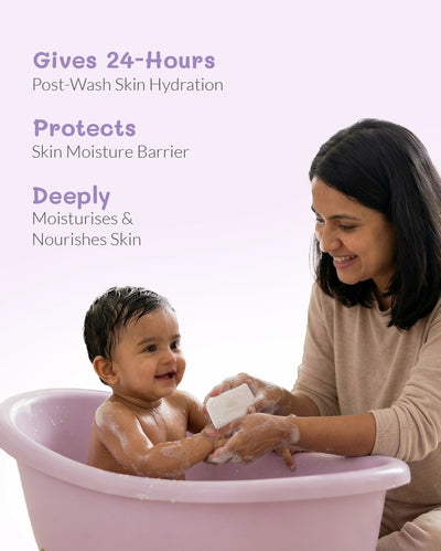 Mom gently bathing baby with gentle newborn skincare bar for 24-hour hydration and moisture barrier protection