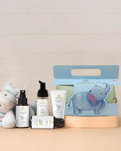 Collection of baby care products with a blue gift box