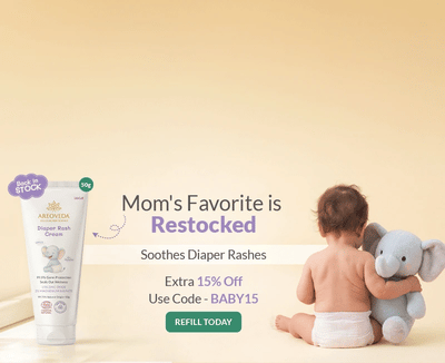 Baby with a toy elephant and diaper rash cream on a beige background